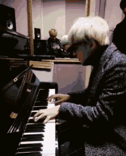 suga playing tiny piano